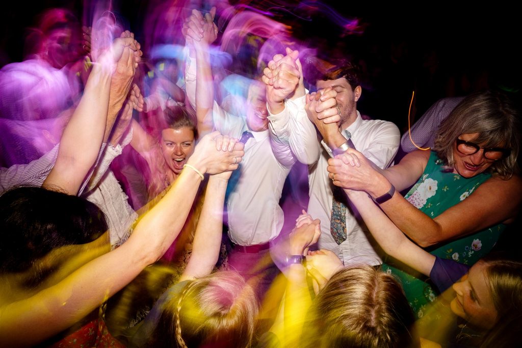 Guests dancing at a wedding in the Marine Theatre Lyme Regis (South West of England).